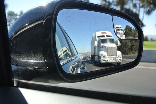 truck in mirror trucking accidents photo