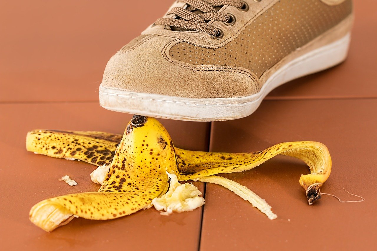 sneaker and banana peel slip and fall image