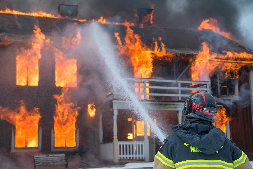 house fire with fireman